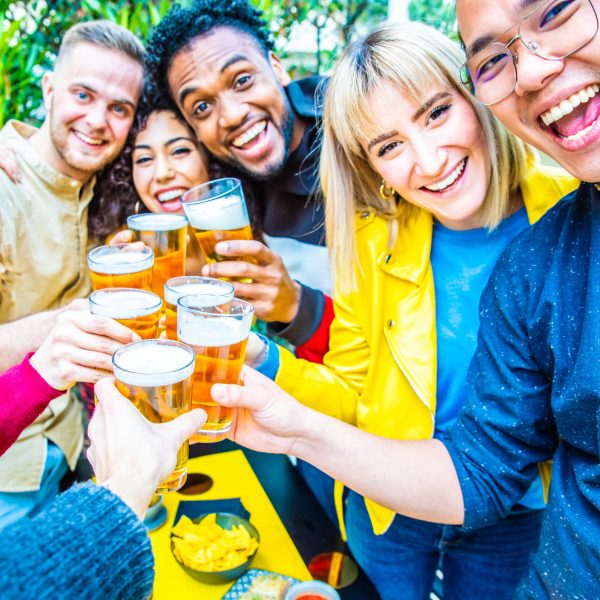 group-of-multicultural-friends-drinking-and-toasti-2026-01-07-23-55-08-utc